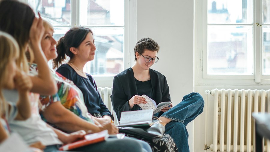 Participants listening in a group workshop